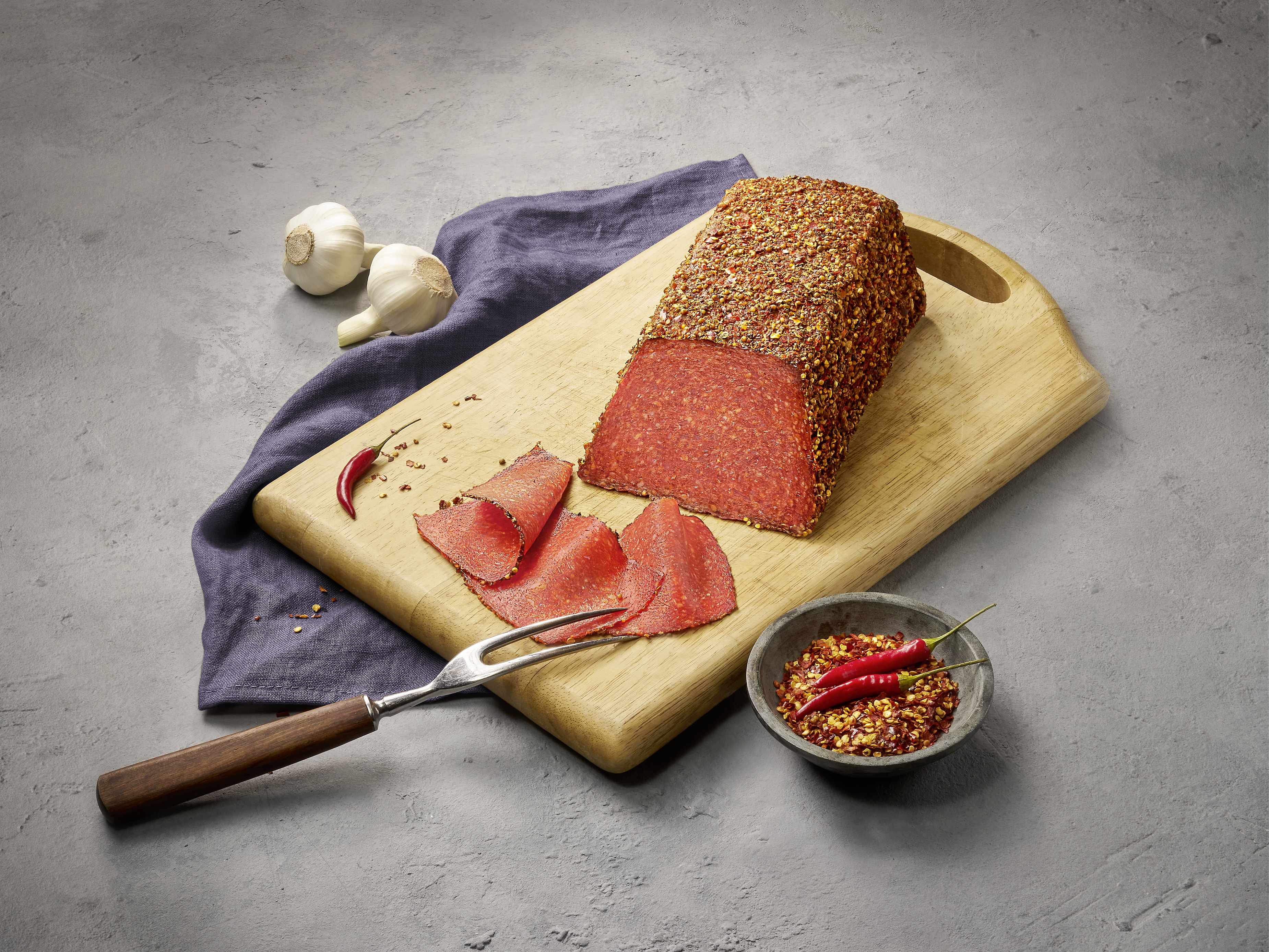 043 Header Reinert Theke Premium-Salami Feurika Chili 4550